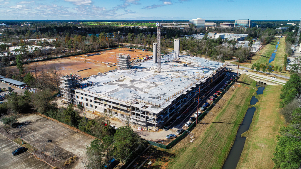 Aerial photograph of a large building under construction.